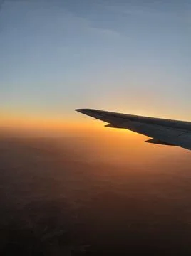 View of the sky and the wing with the iluminator of the aircraft Stock Photos