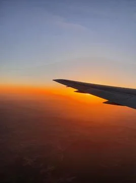 View of the sky and the wing with the iluminator of the aircraft Stock Photos