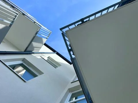 View of the sky between high-rise buildings, looking from the bottom up Foto stock