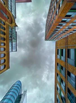 A view of the sky between high-rise buildings. Stock Photos