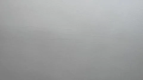 A view of the sky filled with grey clouds, creating a cloudy atmosphere durin Stock Photos