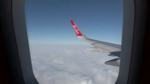 View of sky from inside  airplane cabin while flying over cloud sky scape t.. Stock Footage 245326319