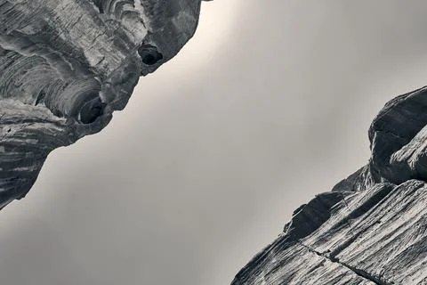 View of the sky from inside an imposing red canyon in 2024 in black and white  Foto stock