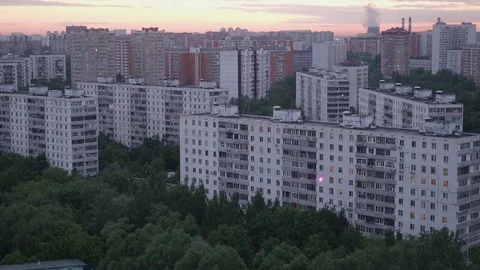 View of sky with moving clouds over big city in summer evening Stock Footage 76898852