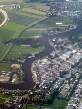 A view from the sky of the surface of the earth with a winding river Stock Photos