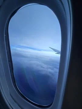 View of Sky Through Airplane Window Stock Photos