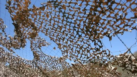 View of the sky through a camouflage net Видео 155865139