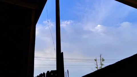 View of Sky Through Framed Open Structure with Utility Lines Vídeos de archivo 305674831