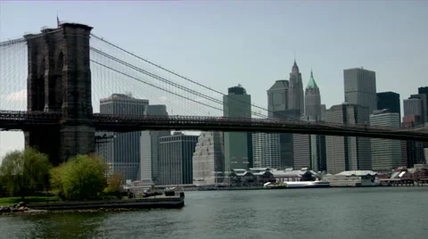  View of skyline and Brooklyn bridge over East River in New York Stock Footage 49224247