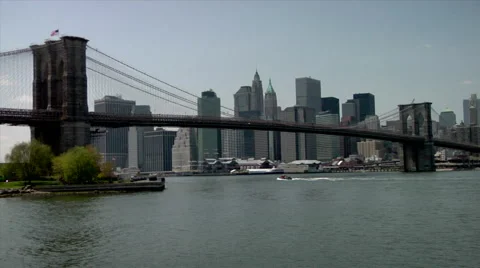  View of skyline and Brooklyn bridge over East River in New York Stock Footage 49224249