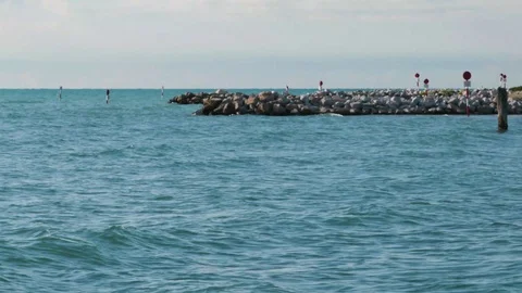 View of skyline cliffs on a sunny day on the Lignano beach Stock Footage 117409611