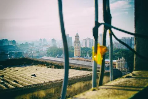 View of the skyline of the metropolis from a dacayed window. Stock Photos