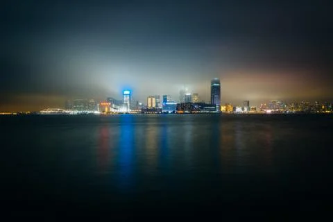 View of the skyline of Tsim Sha Tsui at night, seen from the Expo Promenade i Stock Photos