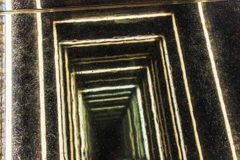 View of skyscraper elevator shaft with illuminated geometric frames creating Stock Photos