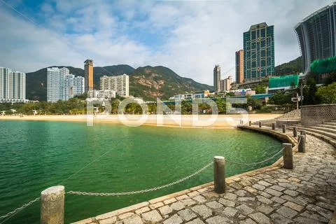 View of skyscrapers and beach from a pier at Repulse Bay, in Hong Kong, Hong Stock Photos