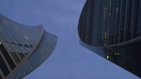 View of skyscrapers from the bottom up with the camera rotation Stock Footage 80125536