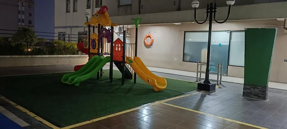 View of a slide at night Stock Photos