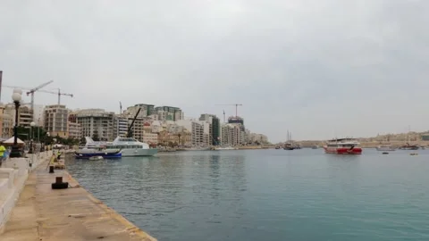 View of Sliema harbour, Malta, in a cloudy and misty day Stock Footage 153804099