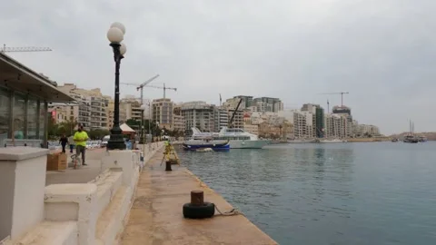 View of Sliema harbour, Malta, in a cloudy and misty day Stock Footage 153804221