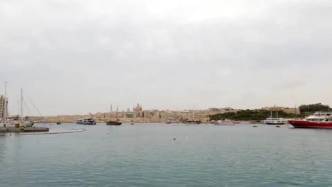 View of Sliema harbour, Malta, in a cloudy and misty day Stock Footage 153804405