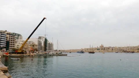 View of Sliema harbour, Malta, in a cloudy and misty day Stock Footage 153804443