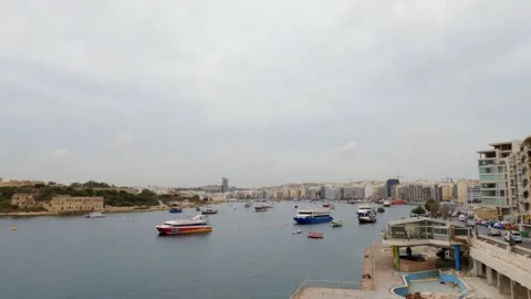 View of Sliema harbour, Malta, in a cloudy and misty day, 4k High angle Stock Footage 153805598