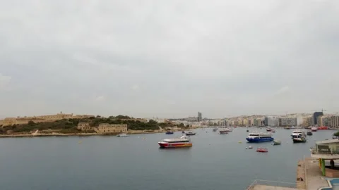 View of Sliema harbour, Malta, in a cloudy and misty day, 4k High angle Stock Footage 153805638
