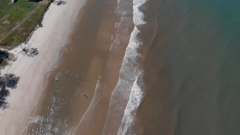 View of slow motion of ocean waves crashing on beach Stock Footage 102430232