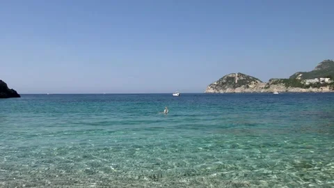 View of a small bay with clear water and gentle waves Stock Footage 134174492