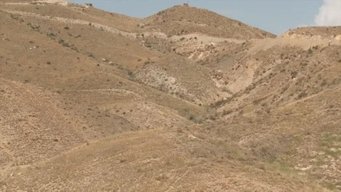 View of a small explosion in the mountains of Afghanistan Stock Footage 85753944