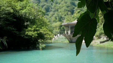View of the small lake and the railway station building in the New Athos Stock Footage 80558367