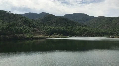 View of a small lake or dam in Benahavis Spain. Beautiful mountains and hills, Stock Footage 132055406