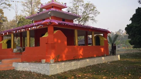 View of a small orange Hindu temple in Dhangadhi, Nepal. Video stock 335472170