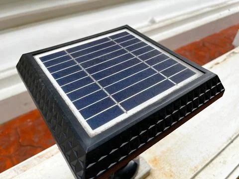 View of a small outdoor solar panel showcasing its textured black frame Foto stock
