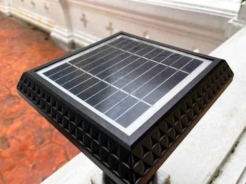 View of a small outdoor solar panel showcasing its textured black frame Foto stock
