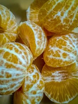 View of small peeled oranges Stock Photos
