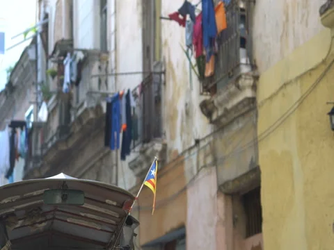 View of small Puerto Rico flag which flutters on wind at building's roof in Stock-Footage 69784262