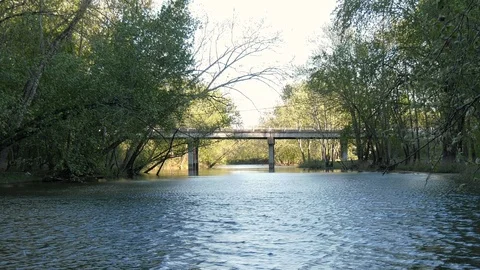 View of a small river and highway bridge Stock Footage 107151626