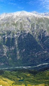 View of a small river with a waterfall flowing Stock Photos
