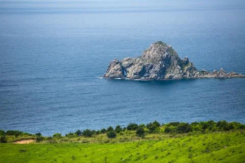 View of a small rocky island in the Japanese Sea Stock Photos