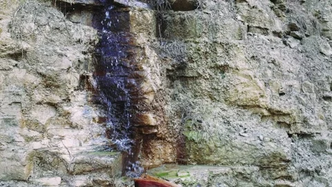 View of a small rocky waterfall surrounded by greenery. Aladag, Turkey. Stock Footage 253334625