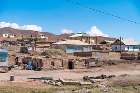 The view of small soviet age remote village in Kyrgyzstan Stock Photos