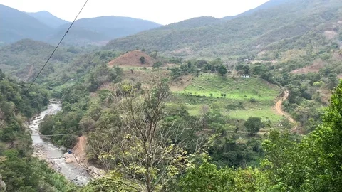 View of small stream, hills and mountains Stock Footage 108547269