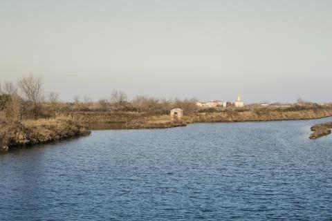 View of the small town of Lio Piccolo among the salt marshes in the Venetia.. Stock Photos