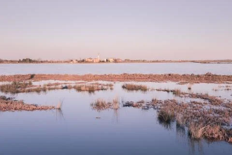 View of the small town of Lio Piccolo among the salt marshes in the Venetia.. Stock Photos