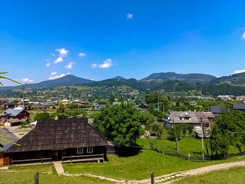 A view of a small town with mountains in the background Stock Photos