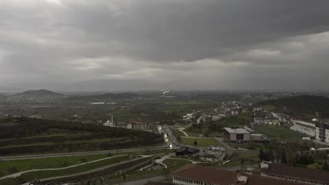 View of Small Town Under Dark Storm Clouds 4K Video Stock Footage 346265068