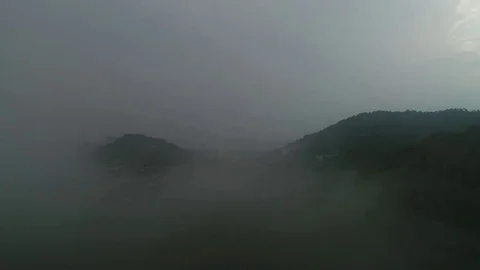 A view of small township from top through the clouds. Видео 79289211