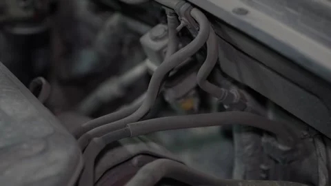 View of small vacuum hoses and pipes inside engine bay. Stock Footage 345911064