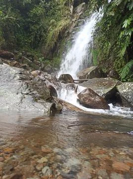 View of a small waterfall on the edge of a small village Stock Photos